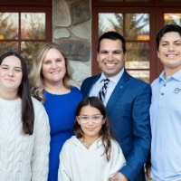 Victor Cardenas poses with family